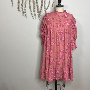 Boohoo Pink Floral Mini Dress on Tan Background